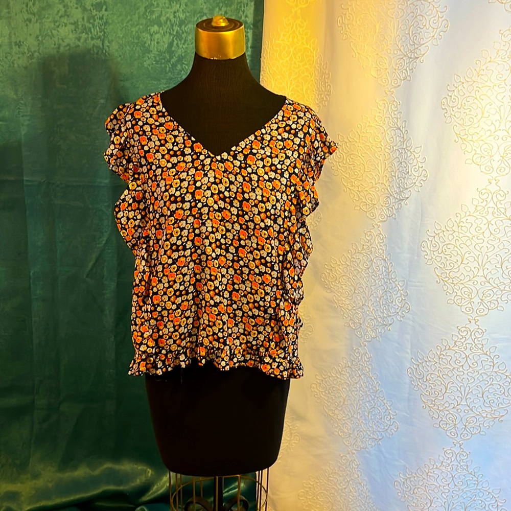 Madison Jules orange and blue ruffle front blouse with ruffle hem.